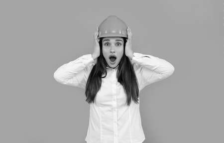 safety business. labor day. shocked woman worker in shirt. quality inspector.の写真素材