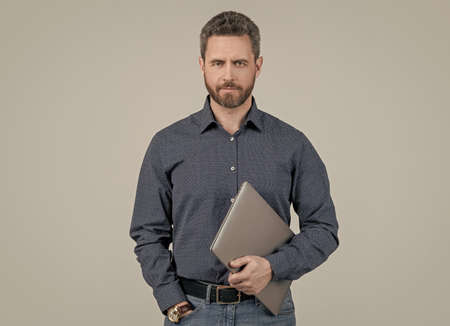 Middle-aged freelancer hold portable laptop computer for working online, freelancing