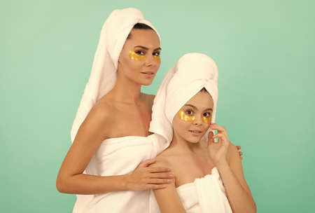 mother and teen girl reduce eye bag. facial collagen skincare cosmetic. moisturizing skin.