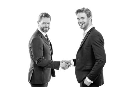 two businessmen colleagues shaking hands after successful business deal, partnershipの写真素材