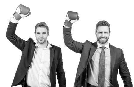 two successful business men in boxing gloves raised hands isolated on white, teamwork success