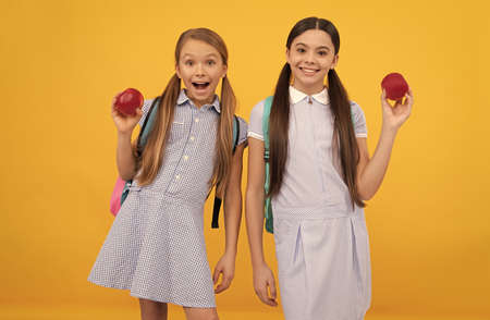 Healthy food for kids. Happy kids hold apples. School nutrition. Food education. Back to school snackの写真素材