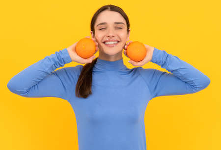 health by natural organic fresh grapefruit. diet and skin beauty. happy girl with orangeの写真素材