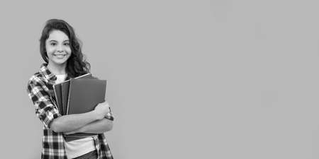 smiling school teen girl ready to study with notebooks, schoolの写真素材