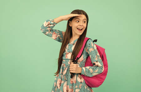 happy child carry backpack going to school looking far away, educationの写真素材