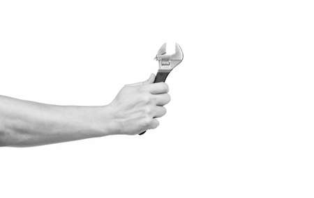 building and repairing tools. hand with repair tool isolated on white background.の写真素材