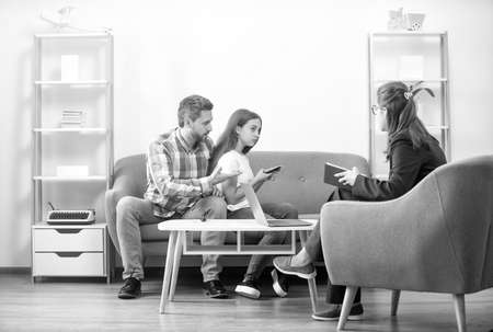 life coach. phone addiction. father and child at psychologist session. family therapyの写真素材