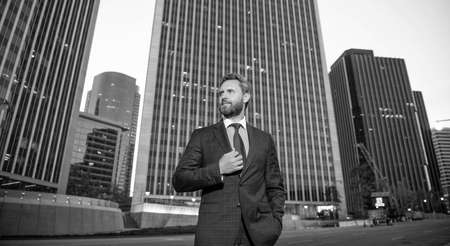 confident businessman in formalwear outside the office, successの写真素材