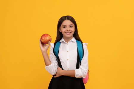 Going back-to-school. Happy child smile holding apple. Back-to-school. September 1の写真素材