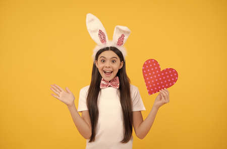 oh my god. time for fun. love. adorable kid holding red heart. paschal spring holiday