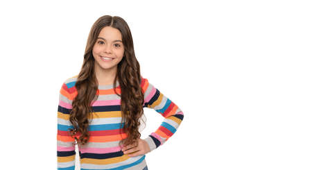 Happy school-aged female child smile in striped sweater isolated on white, girlの写真素材