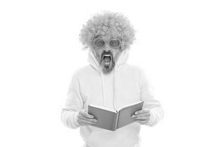Geeky bibliophile in funky wig keep mouth open reading school book, library