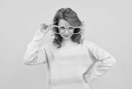 feeling flirty. funny girl wear big glasses. birthday party. express positivity. positive emotions.