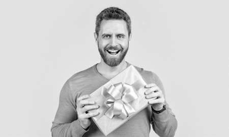 valentines day happiness. boxing day. happy handsome man with present box.の写真素材