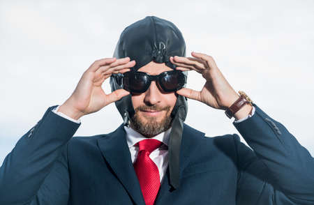 positive businessman in suit and pilot hat get ready