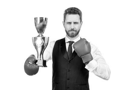 successful businessman in boxing gloves hold champion cup isolated on white background, victory