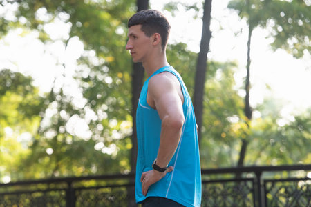 muscular athletic sportsman in sportswear having a breakの写真素材