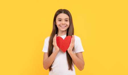portrait of child with heart. happy valentines day. be my valentine. teen girlの写真素材
