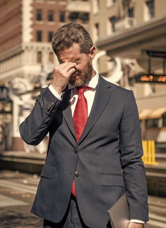 agile business. modern computer communication. portable office outdoor. freelance man hold pcの写真素材