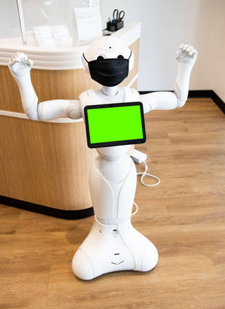 futuristic robot assistant innovative technology in protective mask. strong gestureの写真素材