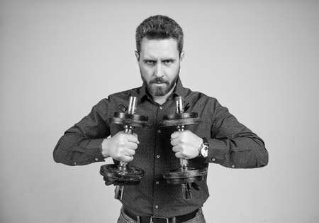 his power. confident man ready for training with barbells. boss show power and authorityの写真素材
