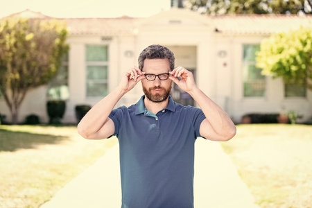 bearded man look through eyeglasses, eye visionの写真素材