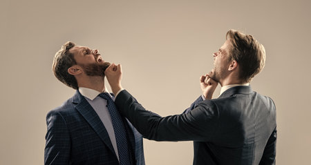 disagreed men business partners fighting aggressive and angry while conflict, business fight.の写真素材