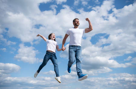 happy father and daughter jump in sky. freedomの写真素材