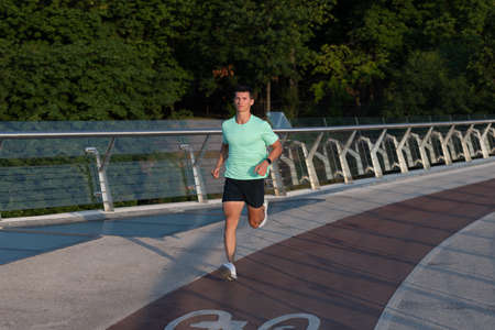 active man runner running in sportswear outdoorの写真素材