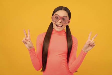 childhood happiness. fancy party look. happy funny kid in glamour eyeglasses with rhinestones