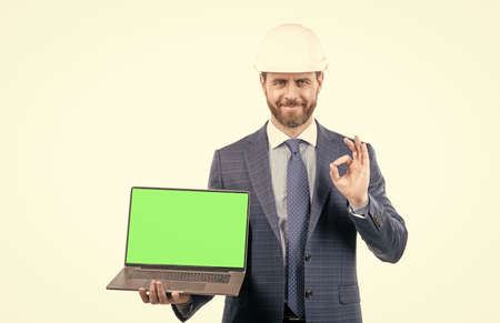 modern wireless laptop. advertisement of future building. businessman presenting project.