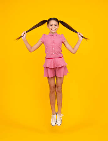 Happy teenager, positive and smiling emotions of teen girl. Excited teenager. Full length funny...