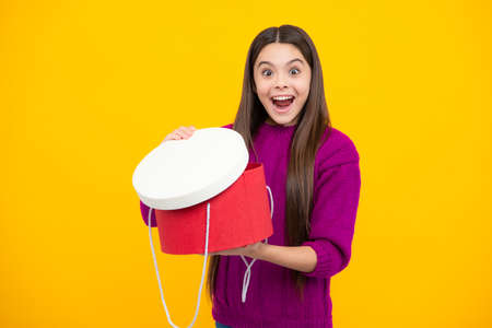 Excited kids face. Teenager child with present box. Teen girl giving birthday gift. Present,...