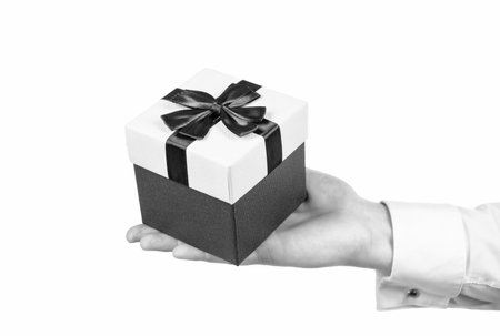 hand holding giftbox. prepare for romance date. business reward. occasion greeting.の写真素材