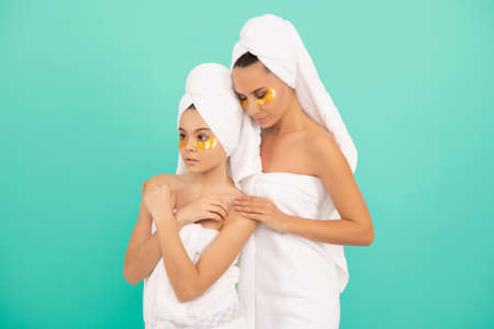 family spa of mother and daughter with skincare patchの写真素材