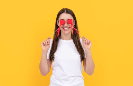 happy valentines day. be my valentine. girl with love symbol on yellow background.の写真素材