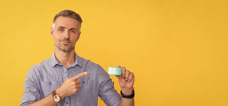 guy hold hair mask or skin cream. daily habit and personal care. skincare beauty.