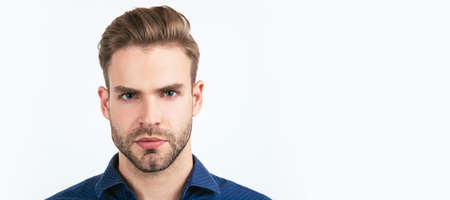 concept of mens beauty. unshaven guy in barbershop. confidence and seriousness. Man face portrait, banner with copy space.の写真素材