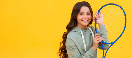 be hydrated. kid sit with racket and water bottle. child with tennis racquet. Horizontal poster of isolated child face, banner header, copy space.の写真素材