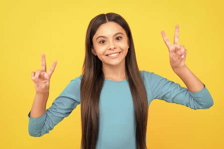 smiling kid with long hair. beauty and fashion. female fashion model.