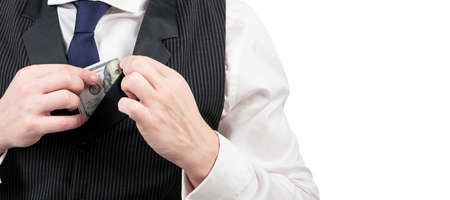 man hold cash isolated on white background. bribery and corruption. payday concept. Horizontal poster design. Web banner header, copy space.の写真素材