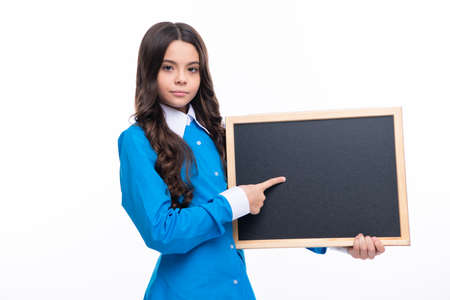 Teenage girl child holding blackboard, isolated on a white background.の写真素材