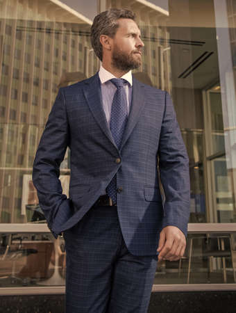 business success. successful man in businesslike suit. manager executive outside the office.の写真素材