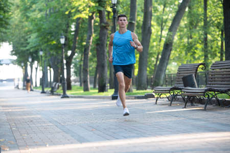 athletic man runner running in sportswear outdoor. anaerobic loadの写真素材