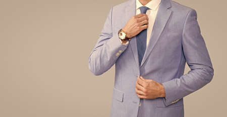 cropped businessman in elegant jacket with tie, copy space, business successの写真素材