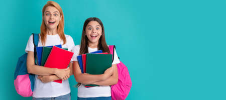 Mother and daughter child banner, copy space, isolated background. amazed pupil and student. mom and teen girl study. private teacher and child.の写真素材