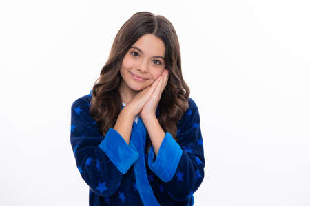 Happy girl face, positive and smiling emotions. Cute young teenager girl against a isolated background. Studio portrait of pretty beautiful child.の写真素材