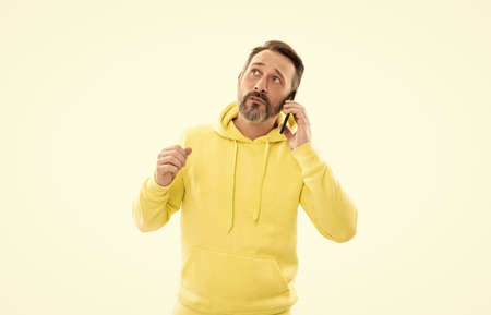 he has a problem. reply on call. phone talk. mature thoughtful man answer the phone.の写真素材