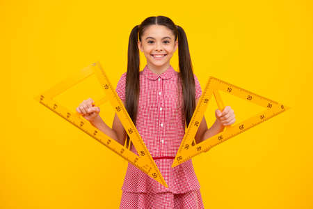 Back to school. Teenager school girl on isolated background. School supplies. Happy teenager, positive and smiling emotions of teen schoolgirl.の写真素材