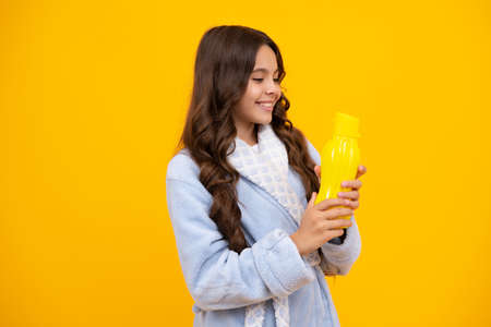 Child teen with water bottle isolated studio background. Water bottle and healthy life. Health and...